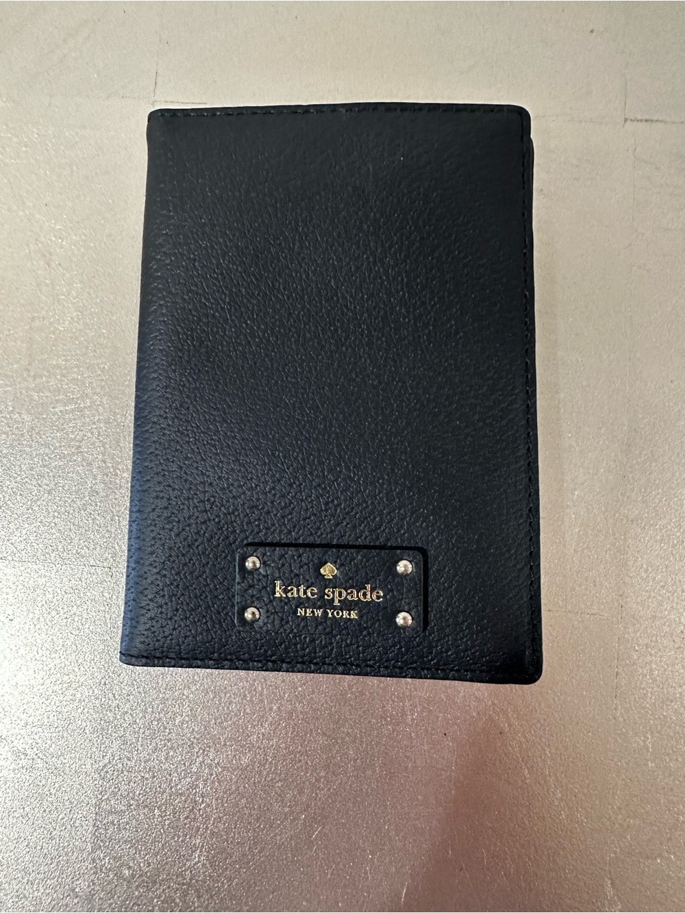 kate spade Black Pebbled Leather Passport Cover with Gold Logo Plate